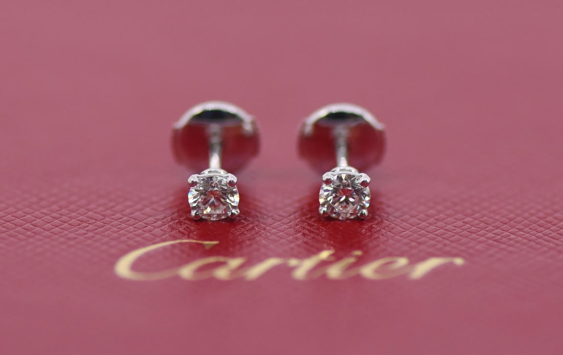 Cartier Diamond Stud Earrings in 18K White Gold 0.34 CTW: Cartier Diamond Stud Earrings in 18K White Gold 0.34 CTW A pair of Cartier diamond stud earrings crafted in 18K white gold. These pre-owned earrings feature a total diamond weight of 0.34 CTW and come