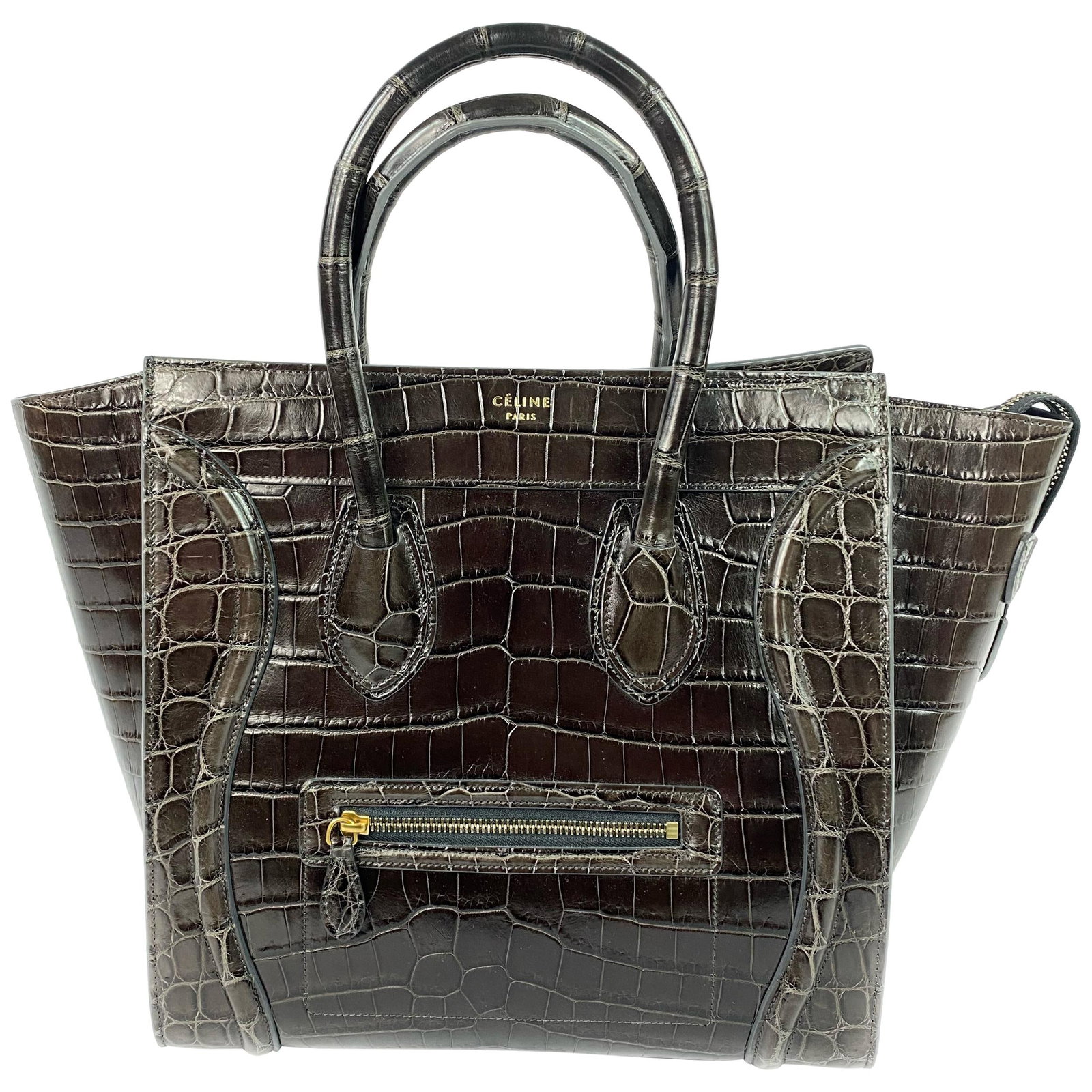Celine Phantom Luggage Medium Tote in Brown Crocodile Leather: Celine Phantom Luggage Medium Tote in Brown Crocodile Leather A Celine Medium Phantom Luggage tote bag in brown crocodile leather with a structured silhouette and top handles. Made in Italy, this 21st