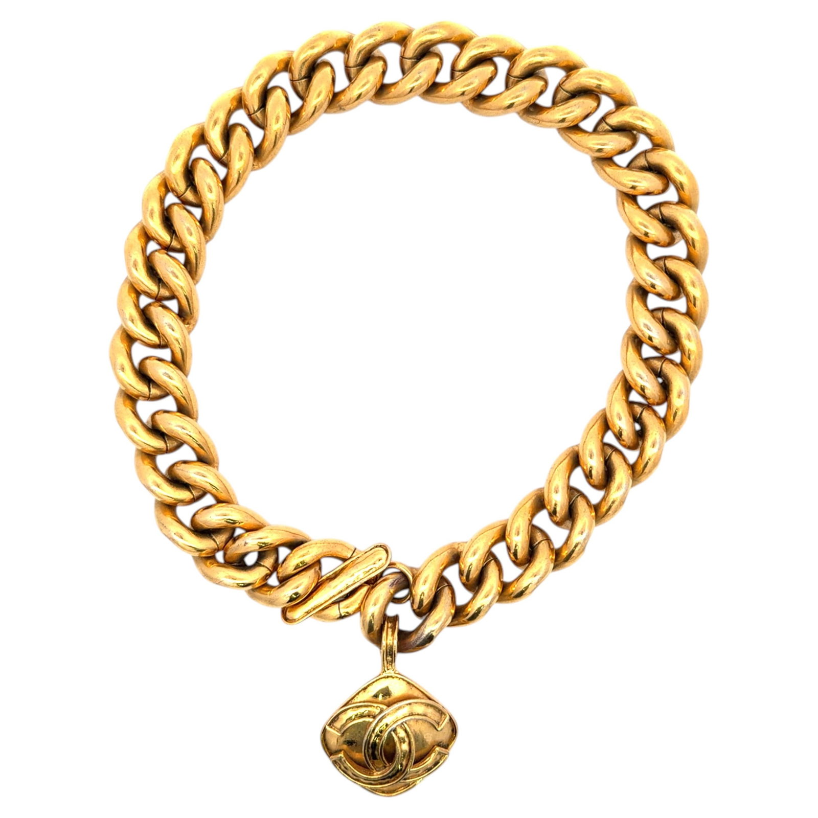 Chanel CC Medallion Toggle Necklace Gold Tone Curb Link Vintage: Chanel CC Medallion Toggle Necklace Gold Tone Curb Link Vintage Vintage Chanel statement necklace with chunky gold-tone curb links, a front toggle closure, and a dangling interlocking CC medallion. Th