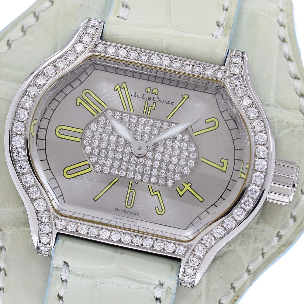 deLaCour City womens quartz wristwatch with diamond bezel: deLaCour City womens quartz wristwatch with diamond bezel deLaCour City quartz wristwatch for women with a diamond bezel and silver dial. This Swiss-made watch features a stainless steel case with a l