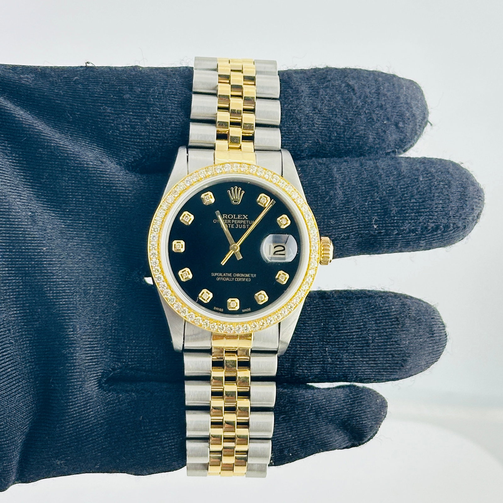 Rolex Datejust 16013 mens watch aftermarket black dial D-Link Jubilee: Rolex Datejust 16013 mens watch aftermarket black dial D-Link Jubilee Rolex Datejust men's watch with an Aftermarket black dial featuring yellow diamond markers, a pave 10K diamond bezel, and a D-Link