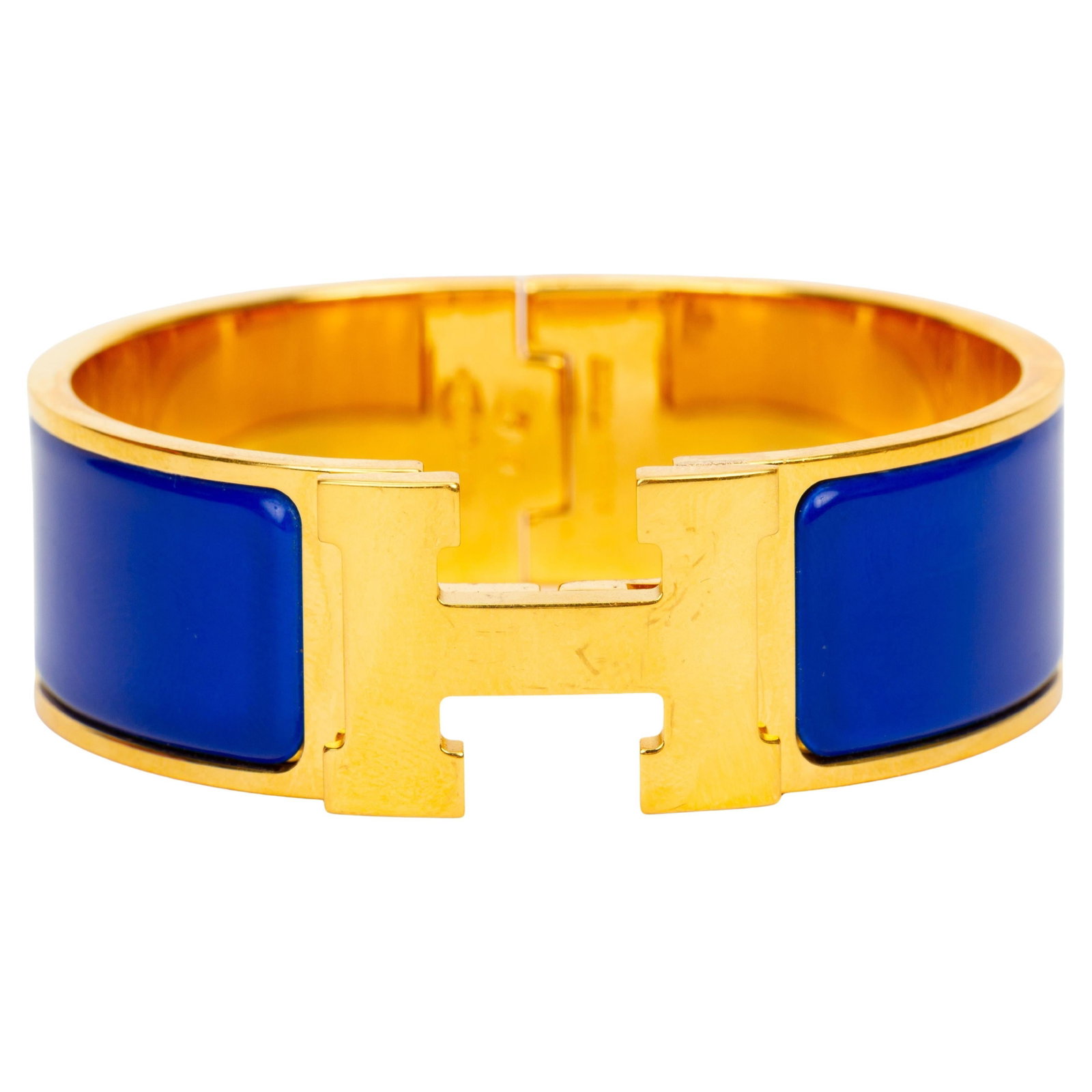 Hermes Clic Clac H Wide Enamel Bracelet Blue: Hermes Clic Clac H Wide Enamel Bracelet Blue Hermes Clic-Clac "H" wide bracelet in vibrant blue enamel with an "H" gold-tone clasp. Made in France and dating to 2020, this 21st century piece is presen
