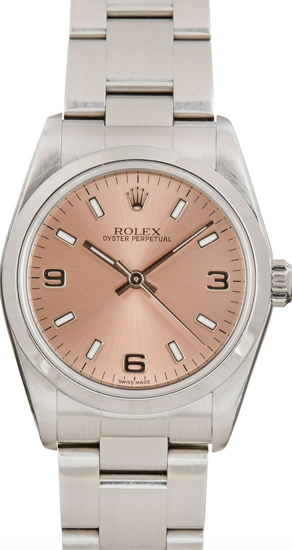 Rolex 77080 Oyster Perpetual Ladies Watch Salmon Pink Dial Steel Bracelet: Rolex 77080 Oyster Perpetual Ladies Watch Salmon Pink Dial Steel Bracelet Rolex Oyster Perpetual ladies wristwatch featuring a salmon pink dial, smooth bezel, and Oyster steel bracelet. Reference 7708