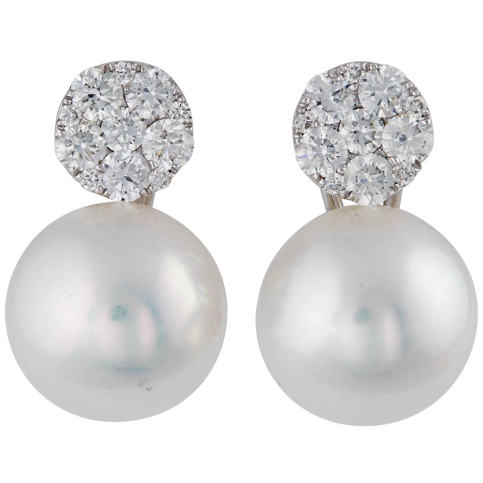 18K White Gold South Sea Pearl Diamond Drop Earrings: 18K White Gold South Sea Pearl Diamond Drop Earrings Pair of contemporary drop earrings crafted in 18k white gold, featuring South Sea pearls suspended beneath round-cut diamond cluster tops. Presente
