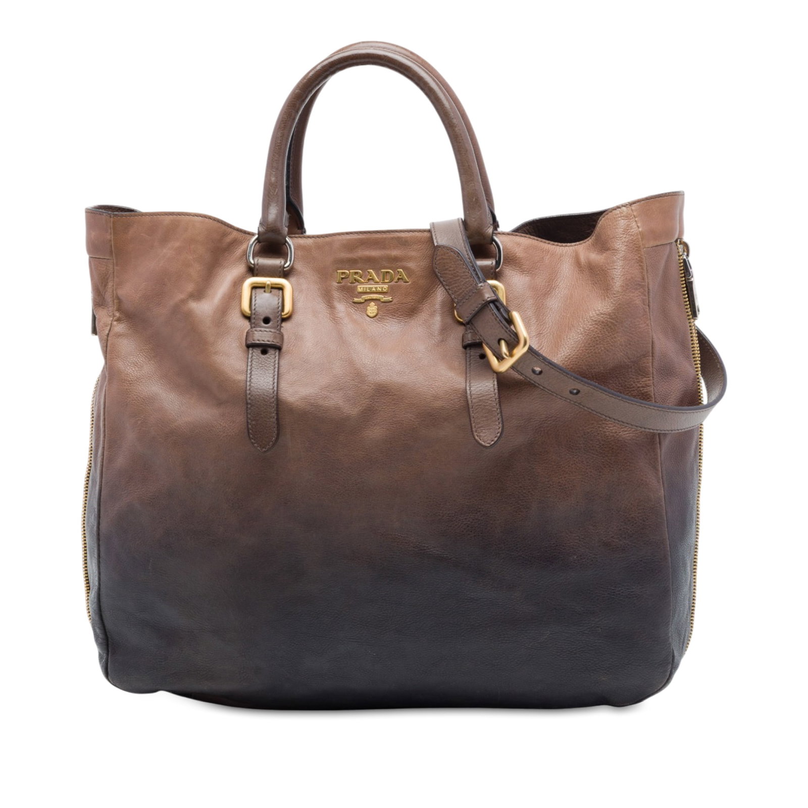 Prada Ombre Vitello Daino Leather Satchel with Shoulder Strap: Prada Ombre Vitello Daino Leather Satchel with Shoulder Strap Prada Ombre Vitello Daino Side Zip Convertible Tote in brown leather with side zip detailing. This tote features rolled leather handles, a