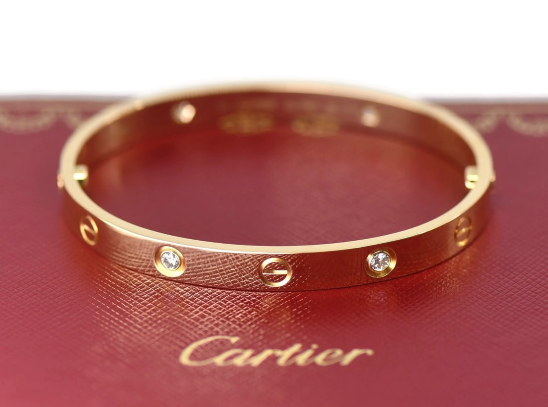 Cartier Love Bracelet 18K Yellow Gold 4 Diamond Bangle Size 17: Cartier Love Bracelet 18K Yellow Gold 4 Diamond Bangle Size 17 Pre-owned Cartier Love bracelet crafted in 18k yellow gold with four diamonds. This bangle-style piece comes with a purchase receipt, box
