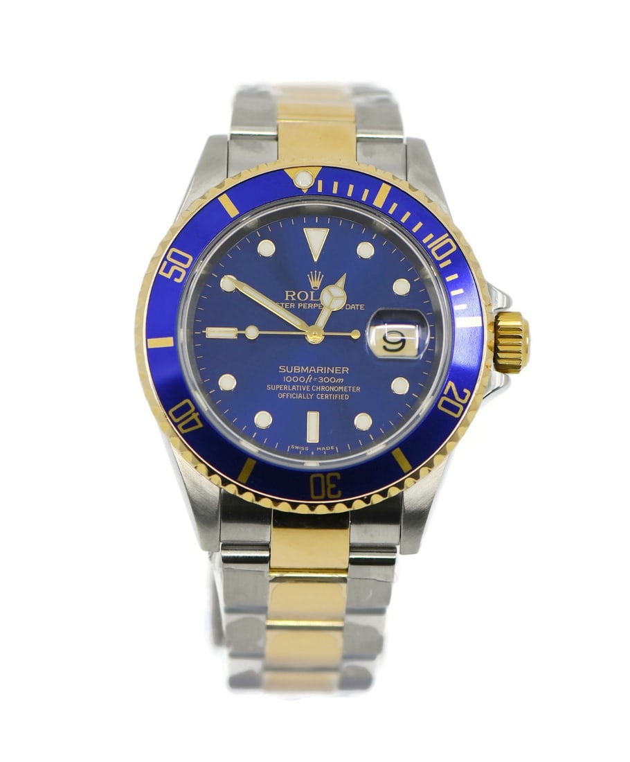 Rolex Submariner 18K Stainless Steel Automatic Watch 16613 with Box and Papers: Rolex Submariner 18K Stainless Steel Automatic Watch 16613 with Box and Papers This exquisite Rolex Submariner wristwatch, model reference 16613, is a stunning blend of luxury and functionality. Craft