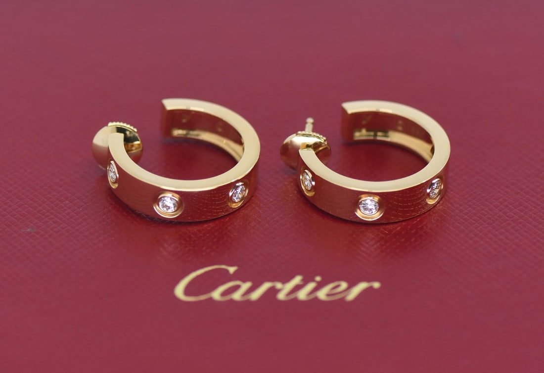 Cartier Love Huggie Earrings 18K Yellow Gold Diamond 21mm: Cartier Love Huggie Earrings 18K Yellow Gold Diamond 21mm Cartier Love huggie earrings crafted in 18k yellow gold and set with diamonds. Made in France, this pre-owned pair includes a recent Cartier s