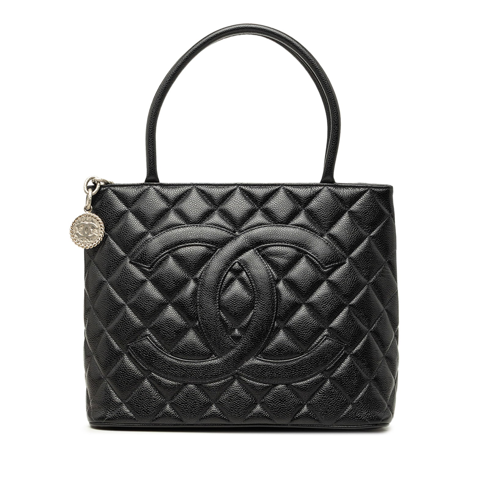 Chanel Medallion Tote Black Caviar Leather Handbag: Chanel Medallion Tote Black Caviar Leather Handbag Chanel Medallion tote crafted in black quilted caviar leather with rolled leather handles and a top zip closure. The bag includes an exterior back sl