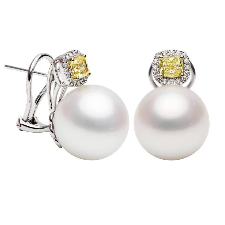 South Sea Pearl Drop Earrings 18K White Gold 15-16 mm: South Sea Pearl Drop Earrings 18K White Gold 15-16 mm One-of-a-kind contemporary drop earrings featuring South Sea pearls accented by yellow and white round-cut diamonds. Crafted in 18k white gold, th