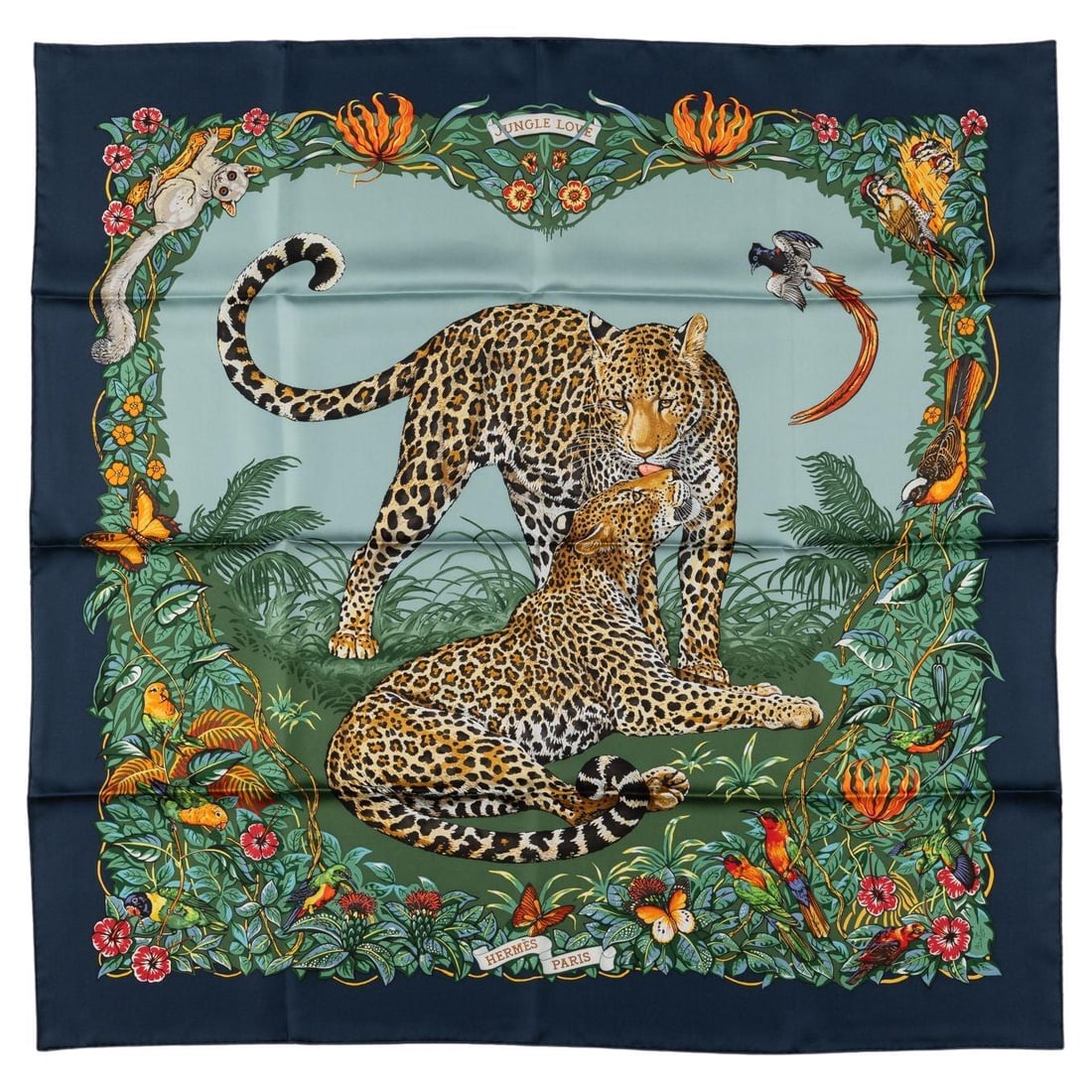 Hermes Jungle Love silk scarf with box and ribbon: Hermes Jungle Love silk scarf with box and ribbon Hermes "Jungle Love" silk scarf designed by Robert Dallet, featuring two leopards framed by a blue border. Crafted from 100% silk with hand-rolled edg