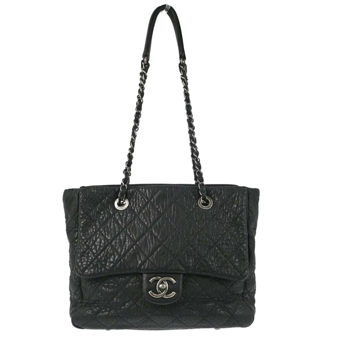 CHANEL Quilted Tote Handbag Black Lambskin Medium: CHANEL Quilted Tote Handbag Black Lambskin Medium Chanel black lambskin tote handbag with double handles and zip closure. This medium tote features a black quilted lambskin exterior and interior pocke