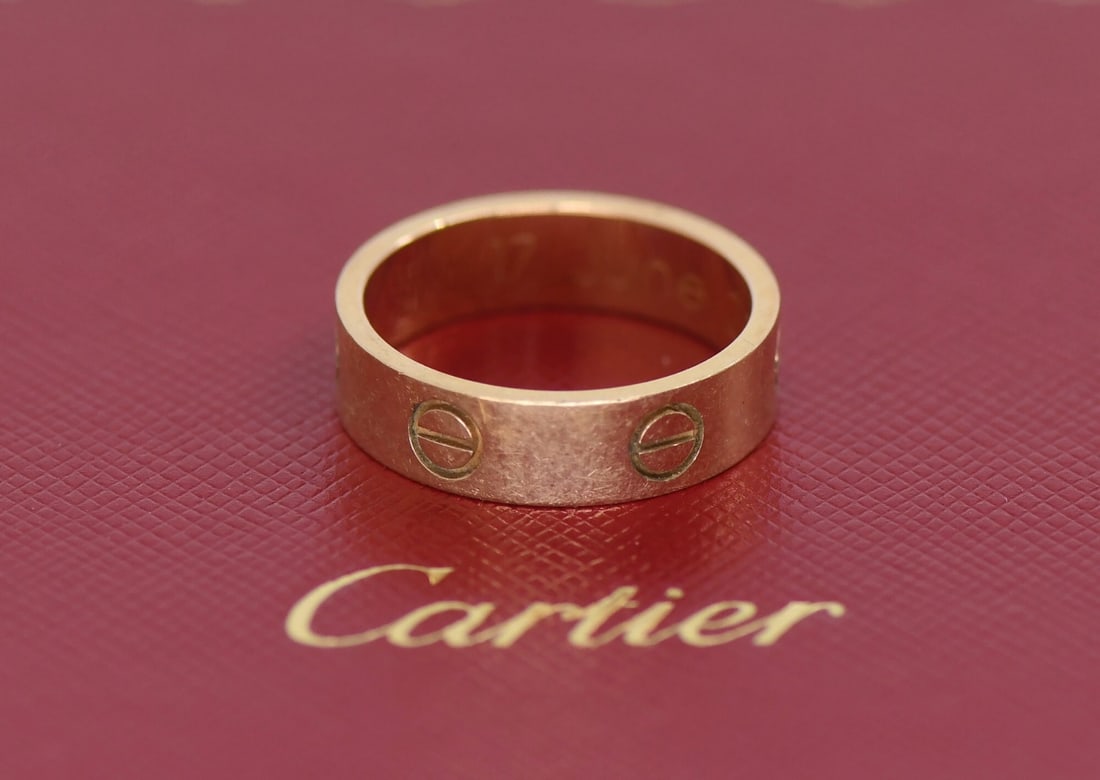 Cartier Love Ring 18K Rose Gold Size 56 5.5mm: Cartier Love Ring 18K Rose Gold Size 56 5.5mm Cartier Love ring crafted in 18k rose gold with the iconic Love design. This pre-owned ring comes with a Cartier purchase receipt and box. Specifications 