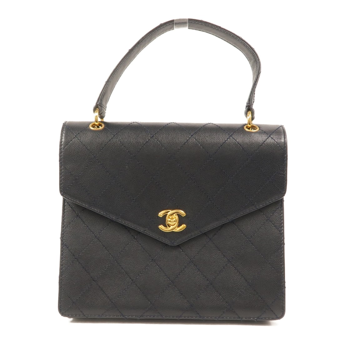 CHANEL CC vintage navy grained calfskin handbag: CHANEL CC vintage navy grained calfskin handbag Vintage CHANEL handbag in navy grained calfskin leather with CC turn-lock closure. The bag features an interior open pocket and one interior zip pocket,