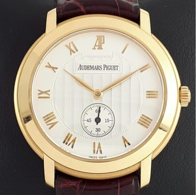 Audemars Piguet Jules watch Ref. 15056OR ivory Roman dial leather strap: Audemars Piguet Jules watch Ref. 15056OR ivory Roman dial leather strap This Audemars Piguet Jules timepiece features an ivory Roman numeral dial and is designed for unisex wear. The watch is fitted w