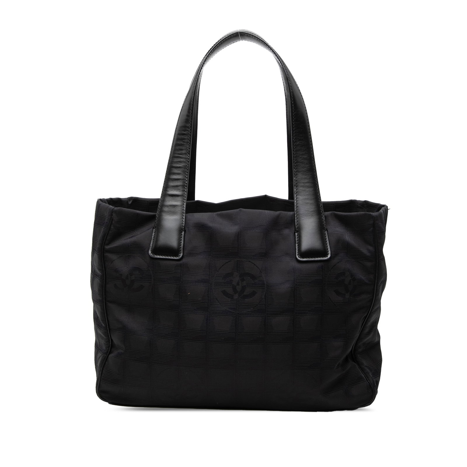 Chanel New Travel Line Black Nylon Tote Bag: Chanel New Travel Line Black Nylon Tote Bag Chanel New Travel Line tote bag crafted with a nylon body and flat leather straps. The bag features an open top and interior zip pockets. Condition is B+ wi