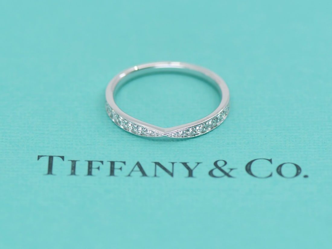 Platinum Diamond Ring Tiffany & Co Harmony 0.23 CT Size 6: Platinum Diamond Ring Tiffany & Co Harmony 0.23 CT Size 6 Tiffany & Co. Harmony diamond ring crafted in platinum with a classic, refined design. This pre-owned ring includes the box. Specifications Br