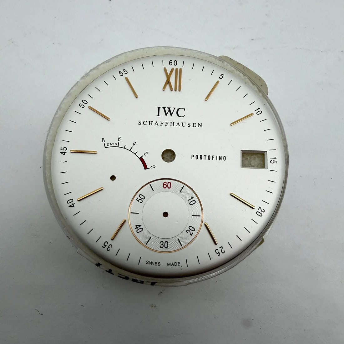 Silver 40 mm watch dial for IWC Portofino mens: Silver 40 mm watch dial for IWC Portofino mens Pre-owned IWC Schaffhausen Portofino silver dial for a men's watch. This is a replacement dial only and shows signs of wear. Specifications Brand: IWC It