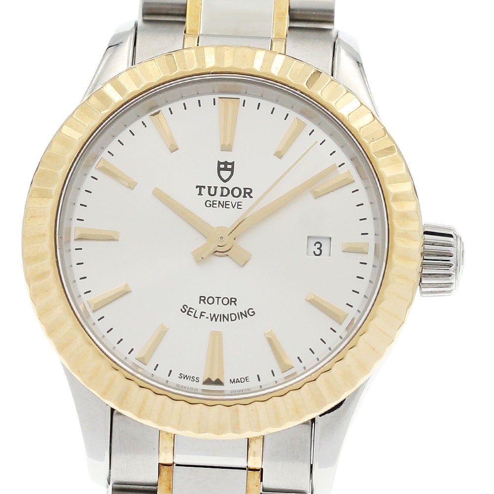 TUDOR Style 12113 Women's Automatic Date Wristwatch: TUDOR Style 12113 Women's Automatic Date Wristwatch TUDOR Style Date automatic women's wristwatch with a silver dial and date display. The watch shows light to minor wear consistent with prior use, in