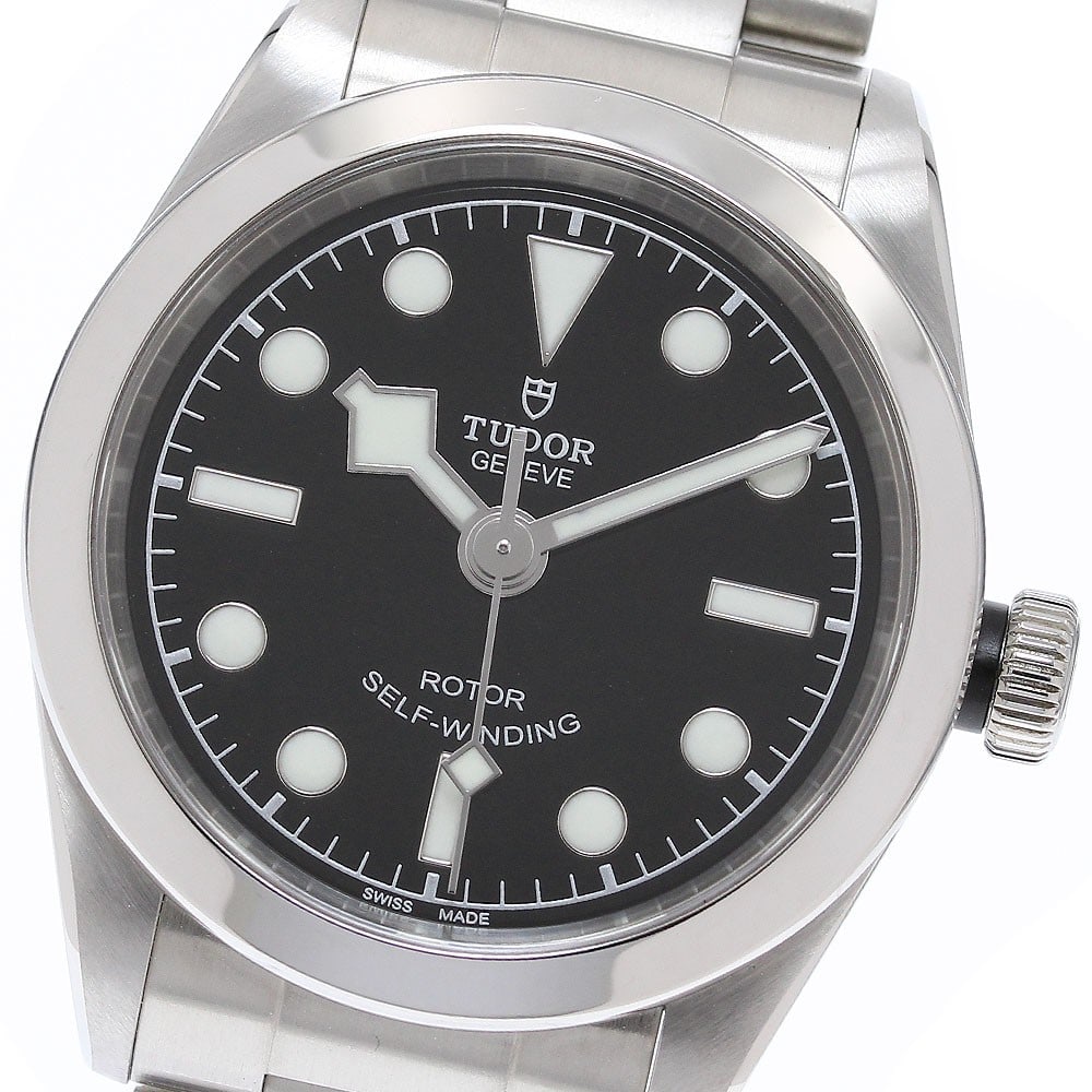 TUDOR Heritage Black Bay 32 Ref 79580 Automatic Stainless Steel Watch: TUDOR Heritage Black Bay 32 Ref 79580 Automatic Stainless Steel Watch TUDOR Heritage Black Bay 32 automatic women's wristwatch with a black dial and stainless steel case and bracelet. This Swiss-made 