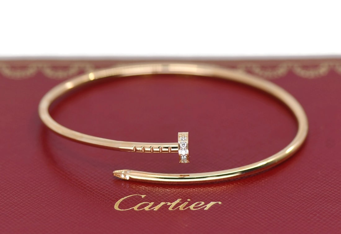 Cartier Juste un Clou SM 18K Rose Gold Diamond Bangle Size 18: Cartier Juste un Clou SM 18K Rose Gold Diamond Bangle Size 18 Cartier Juste un Clou small model bracelet crafted in 18k rose gold and set with diamonds. This pre-owned bangle from the Juste un Clou co