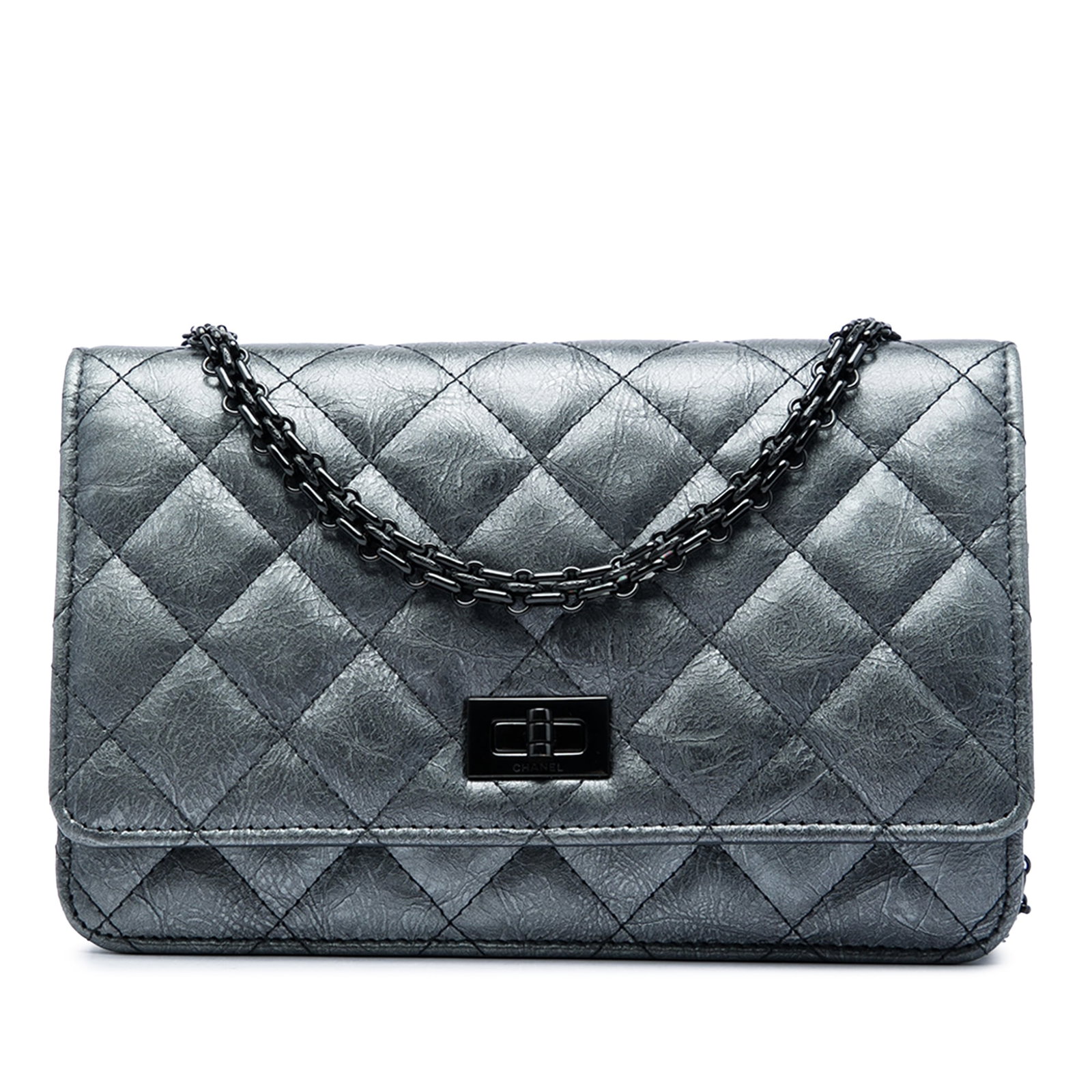 Chanel Reissue 2.55 Wallet on Chain in Quilted Aged Calfskin: Chanel Reissue 2.55 Wallet on Chain in Quilted Aged Calfskin A Chanel Reissue 2.55 wallet on chain in gray quilted aged calfskin. This Italian-made bag features a chain link strap, a flap with twist l