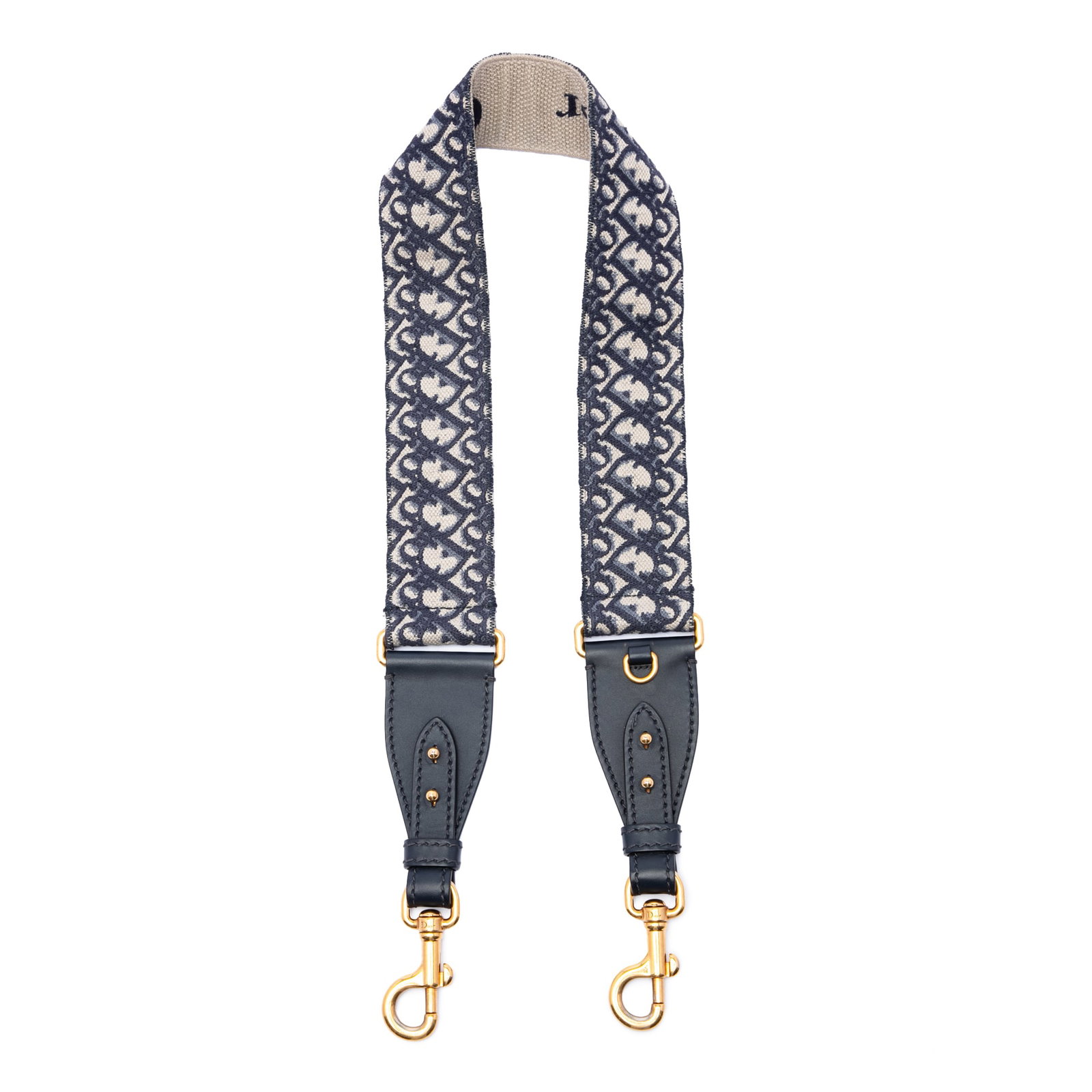 Dior Oblique bag strap in embroidered canvas: Dior Oblique bag strap in embroidered canvas Dior Oblique bag strap in blue embroidered canvas with gold-tone metal hardware. Made in Italy, this shoulder strap offers a distinctive designer look and 
