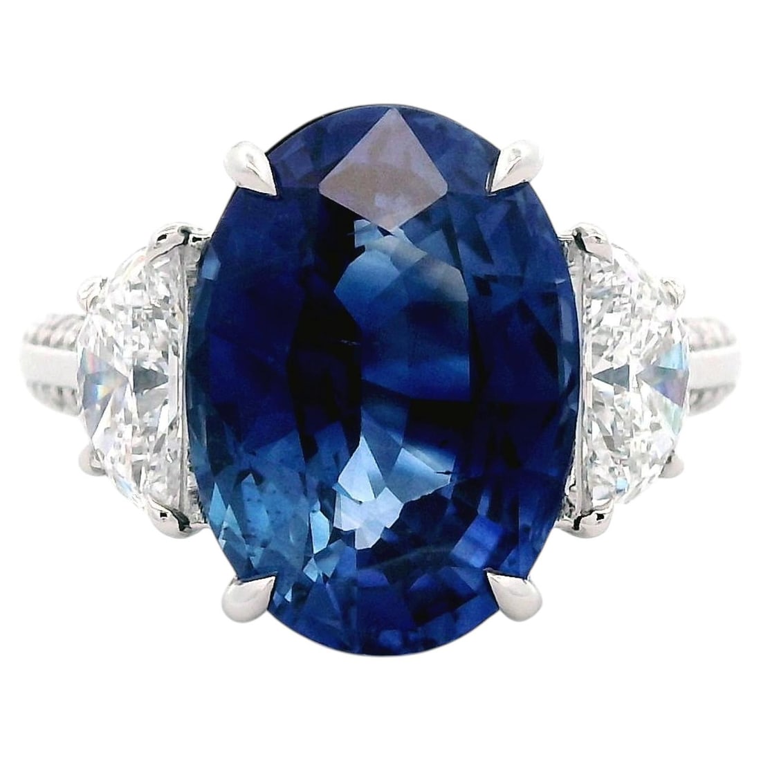 Platinum 3 Stone Ring GIA Oval Sapphire Diamond: Platinum 3 Stone Ring GIA Oval Sapphire Diamond Contemporary 3-stone ring featuring a natural oval Ceylon blue sapphire, flanked by natural half-moon diamonds and accented with a double row of diamond