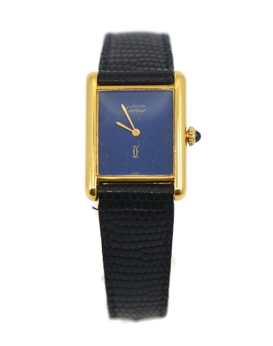 Cartier Tank Must manual wristwatch blue dial gold plated case: Cartier Tank Must manual wristwatch blue dial gold plated case Vintage Cartier Tank Must wristwatch with a rectangular polished case, blue dial, and Roman numeral indices. This women's watch features 