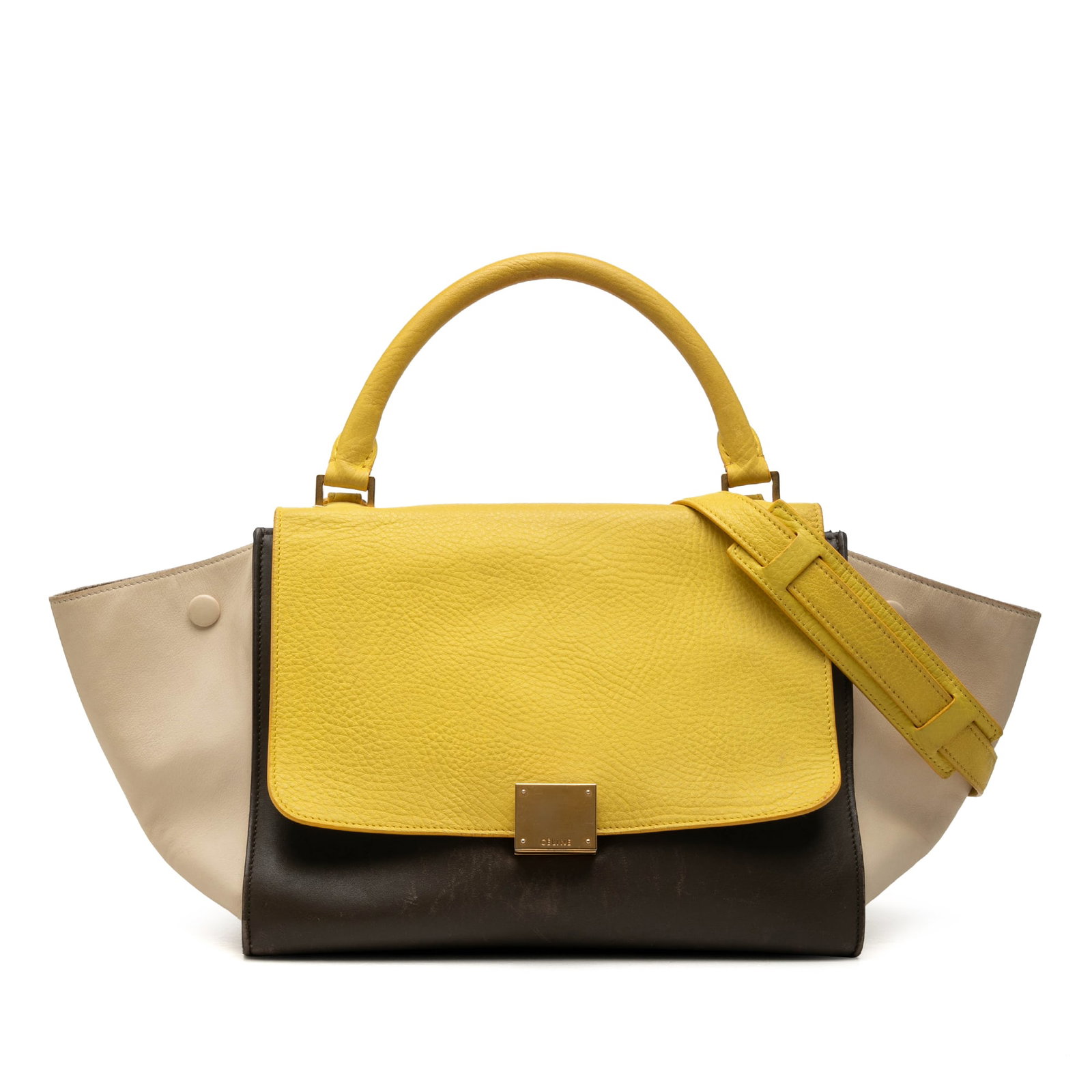 Celine Trapeze Medium Leather Satchel with Detachable Strap: Celine Trapeze Medium Leather Satchel with Detachable Strap A Celine Medium Tricolor Leather Trapeze Satchel crafted in leather with a structured silhouette. This satchel features a rolled top handle,