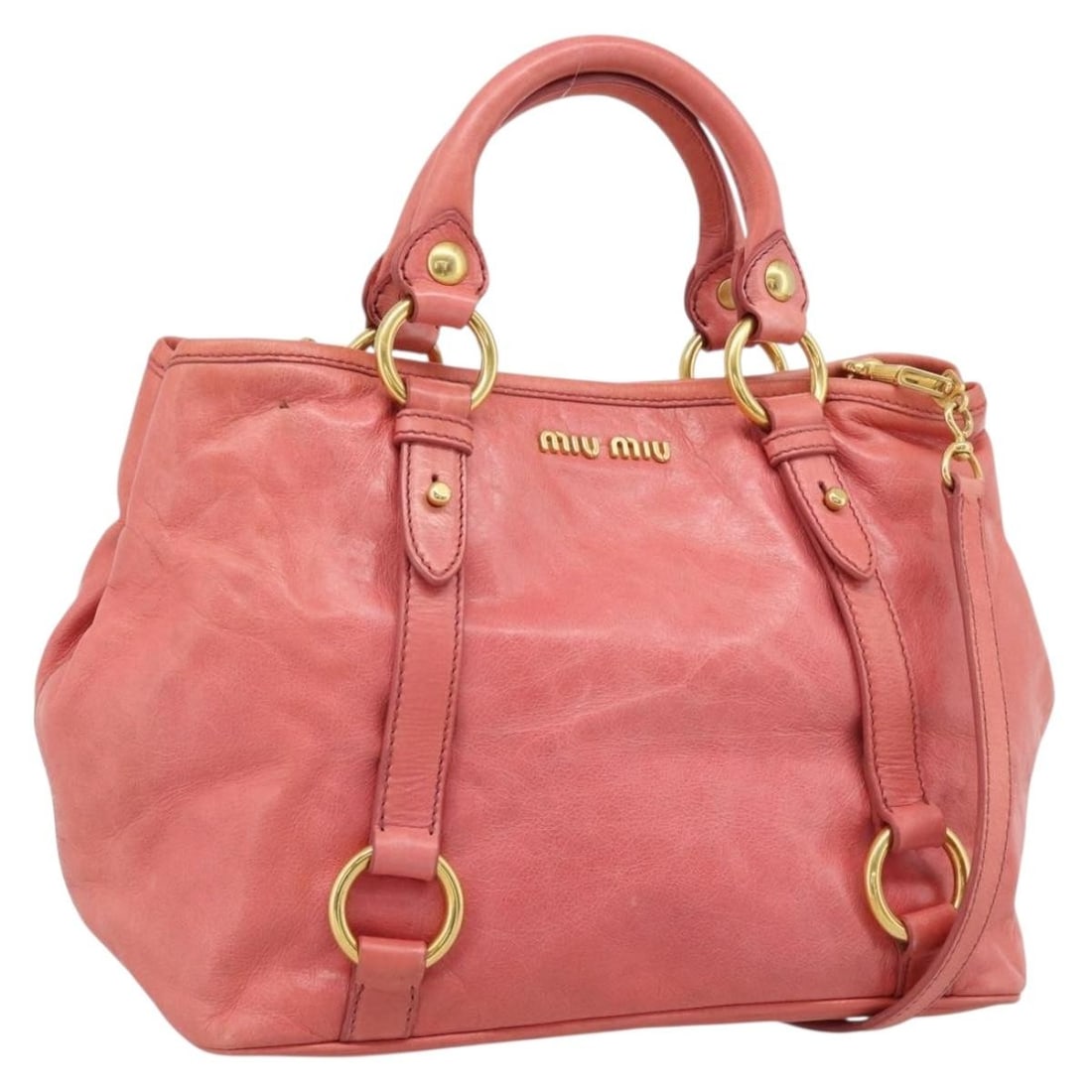 Miu Miu Pink Leather 2way Handbag with Shoulder Strap: Miu Miu Pink Leather 2way Handbag with Shoulder Strap Miu Miu 2-way handbag in pink leather with gold-tone accents. Designed for women, this Italian-made bag includes both top handles and a shoulder s