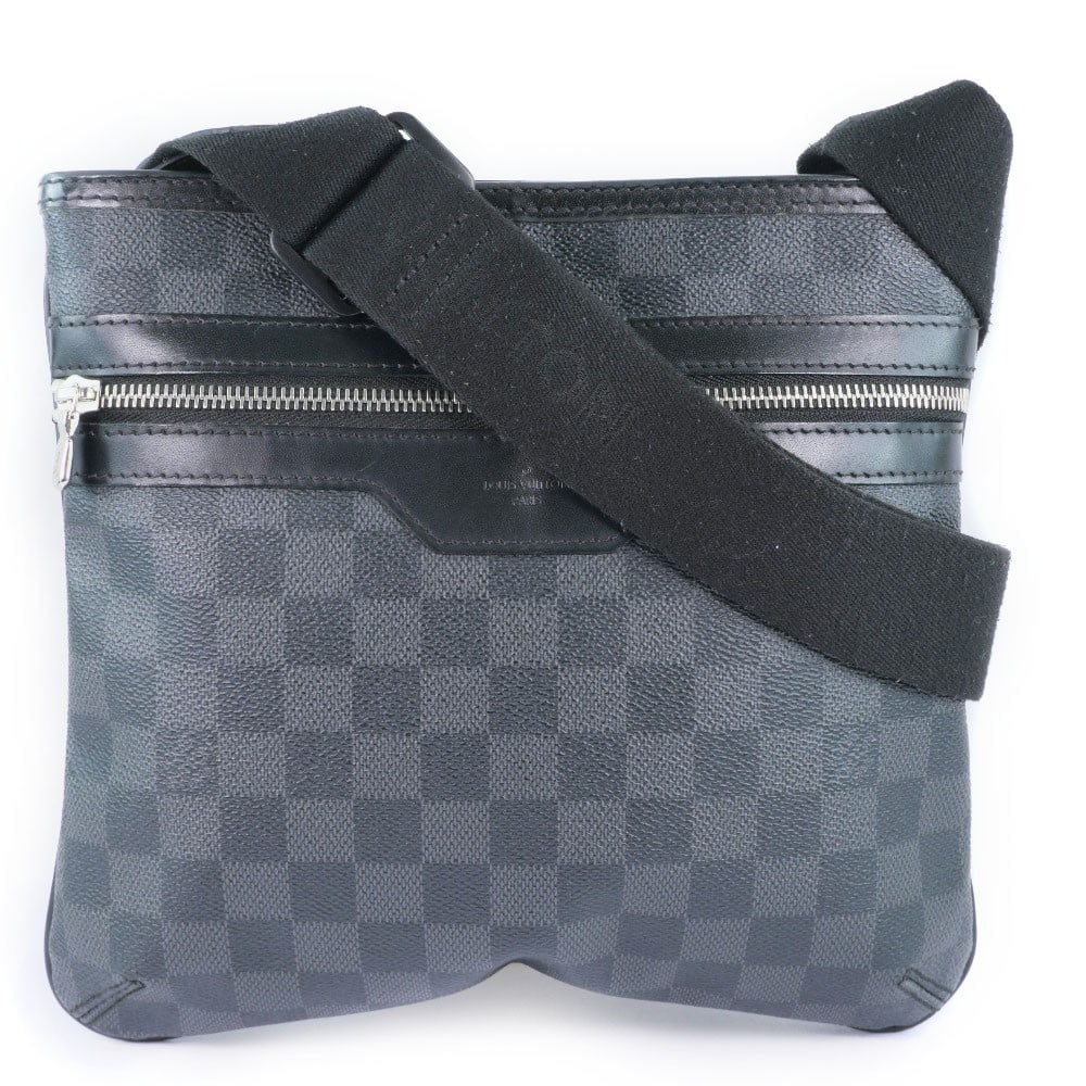 Louis Vuitton Thomas Unisex Canvas Bag in Black: Louis Vuitton Thomas Unisex Canvas Bag in Black The Louis Vuitton Thomas Handbag in Damier Graphite canvas is a unisex accessory featuring a sleek black color. Crafted in France, it measures 25cm x 23