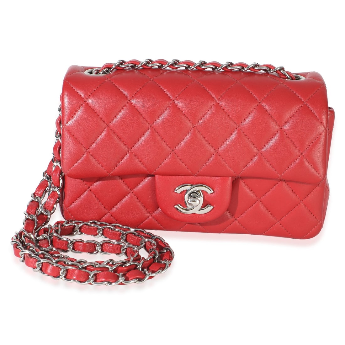 Chanel Mini Rectangular Classic Flap Red Lambskin Crossbody Bag: Chanel Mini Rectangular Classic Flap Red Lambskin Crossbody Bag Chanel Mini Rectangular Classic Flap Bag in red quilted lambskin with a turnlock closure and silver-tone hardware. This pre-owned bag fe
