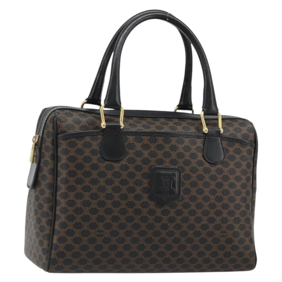 CELINE Macadam Boston Bag in Black PVC Leather: CELINE Macadam Boston Bag in Black PVC Leather This CELINE Boston bag is crafted from PVC leather and Macadam canvas in a black and gold colorway. Made in Italy, it features a handle drop of approxima