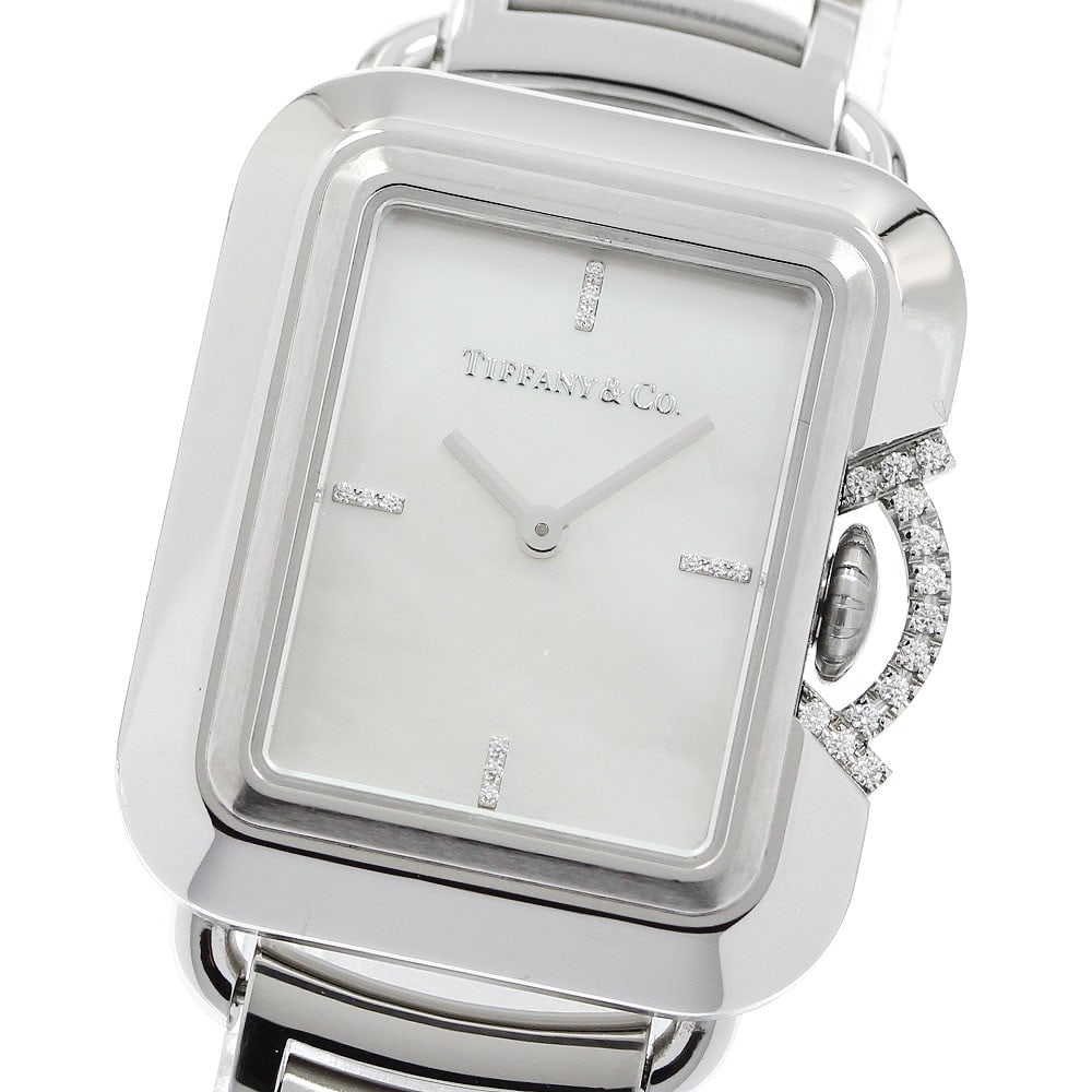 TIFFANY&Co. T Rectangle Diamond Quartz Women's Stainless Steel Watch 69546161: TIFFANY&Co. T Rectangle Diamond Quartz Women's Stainless Steel Watch 69546161 TIFFANY&Co. T Rectangle Crown Guard women's wristwatch with a quartz movement and a white mother-of-pearl dial. This watch