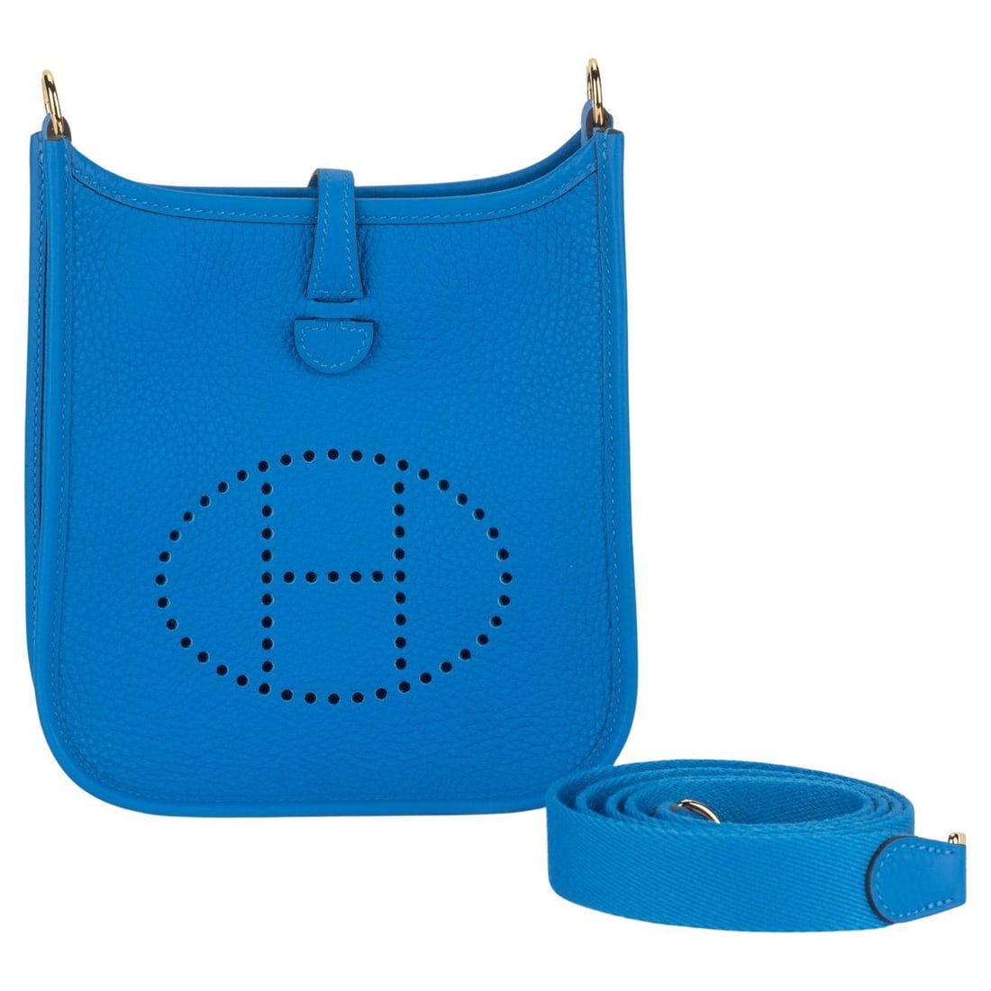 Hermes Mini Evelyne bag in Blue de France Clemence leather: Hermes Mini Evelyne bag in Blue de France Clemence leather Hermes Mini Evelyne bag in Blue de France Clemence leather with gold hardware. Features a detachable flat strap, an open top with tuck closur