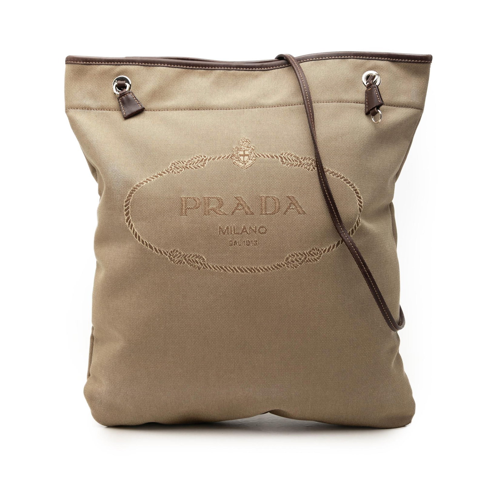 Prada Canapa Logo Canvas Crossbody Bag Beige: Prada Canapa Logo Canvas Crossbody Bag Beige Prada Canvas Canapa Logo Crossbody in beige fabric with leather trim. This crossbody bag features a flat leather strap, an open top with magnetic snap clos