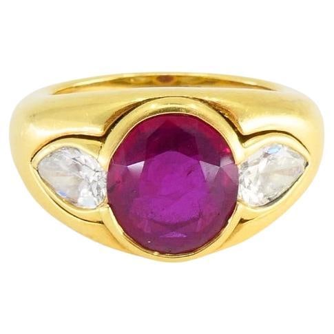 Bulgari vintage 18k gold band ring with cabochon ruby diamonds AGL GIA: Bulgari vintage 18k gold band ring with cabochon ruby diamonds AGL GIA Vintage Bvlgari Bulgari band ring in 18k gold, featuring a cabochon ruby accented by diamonds in a bold, slightly domed design. T