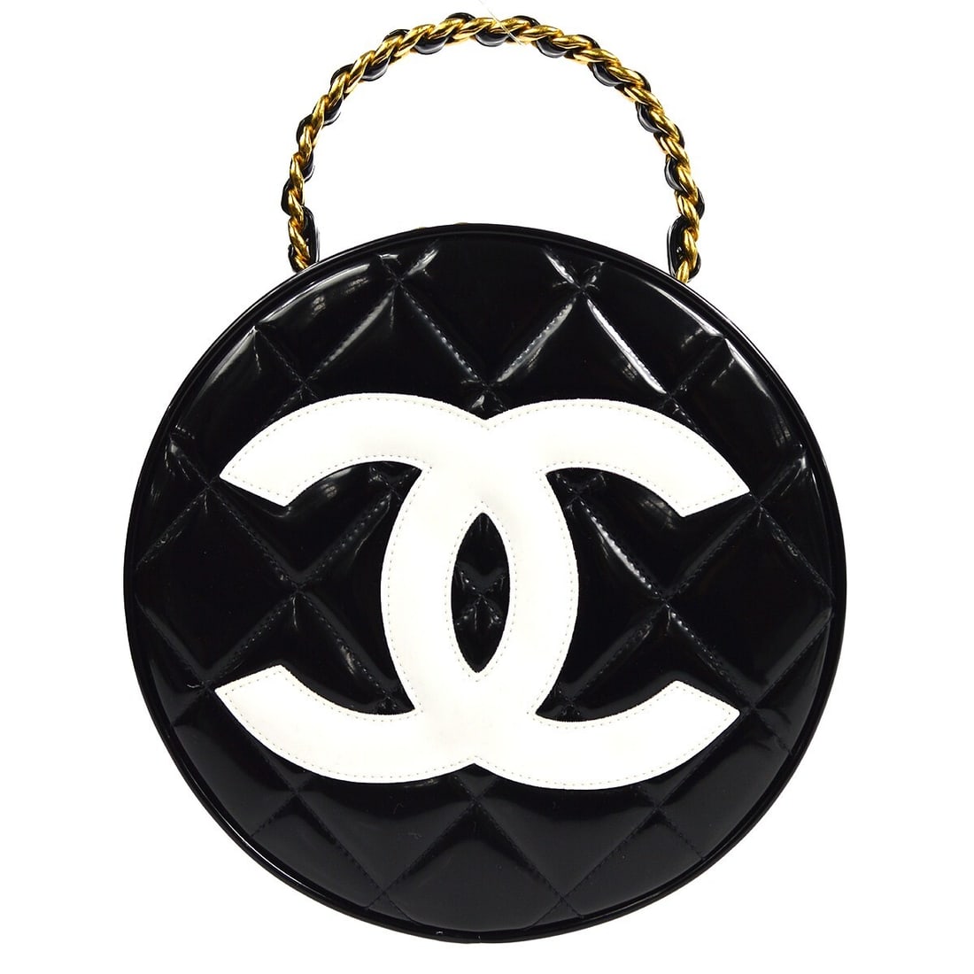 Chanel Quilted Round Vanity Handbag in Black Patent Leather: Chanel Quilted Round Vanity Handbag in Black Patent Leather Round Chanel vanity handbag in black patent leather with a matelasse quilted design and prominent logo accent. This medium top-handle bag fe