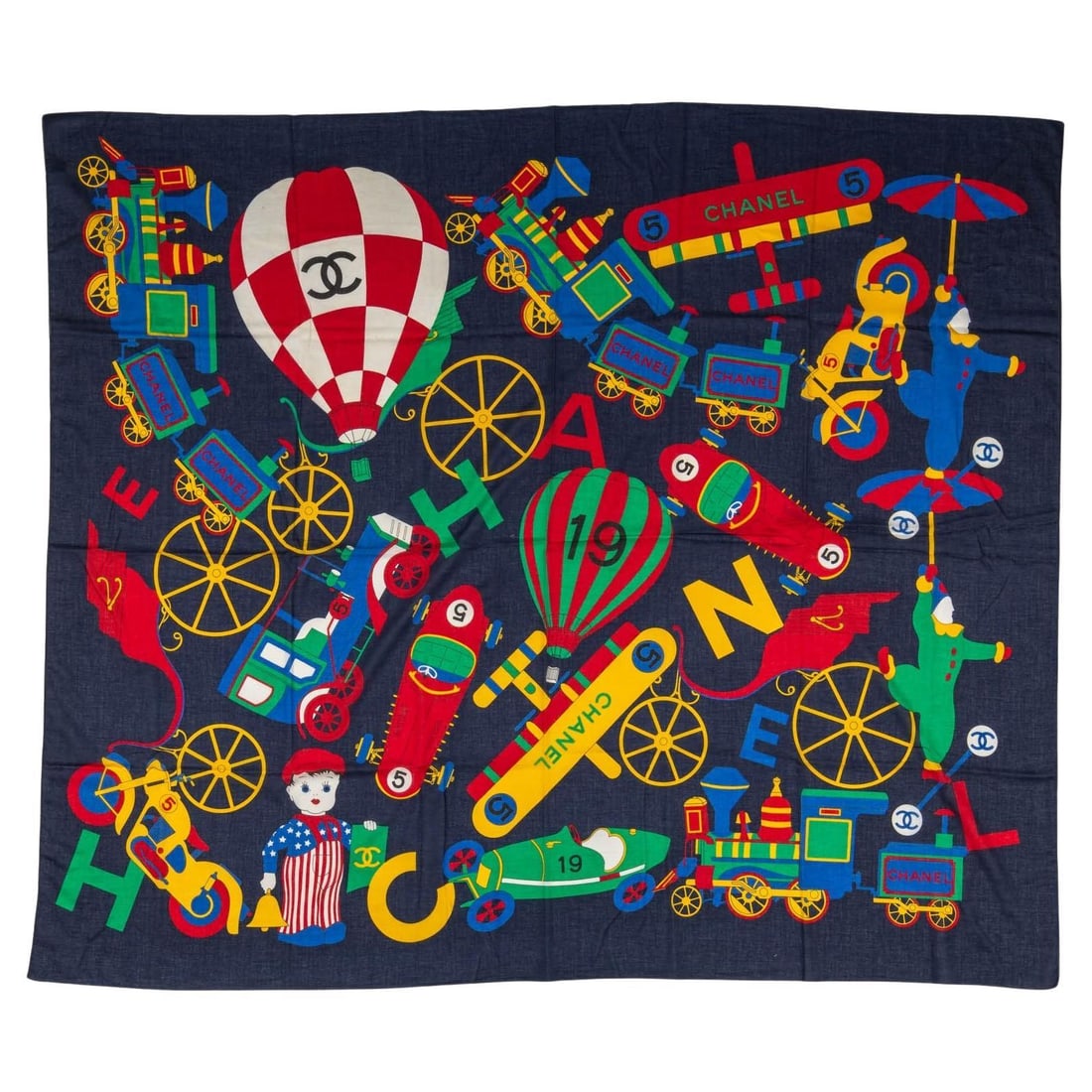 Chanel Vintage Navy Cotton Sarong Air Balloons Trains Design: Chanel Vintage Navy Cotton Sarong Air Balloons Trains Design Elevate your beachwear with this exquisite Chanel vintage navy cotton sarong. Featuring a playful design of air balloons and trains, this s