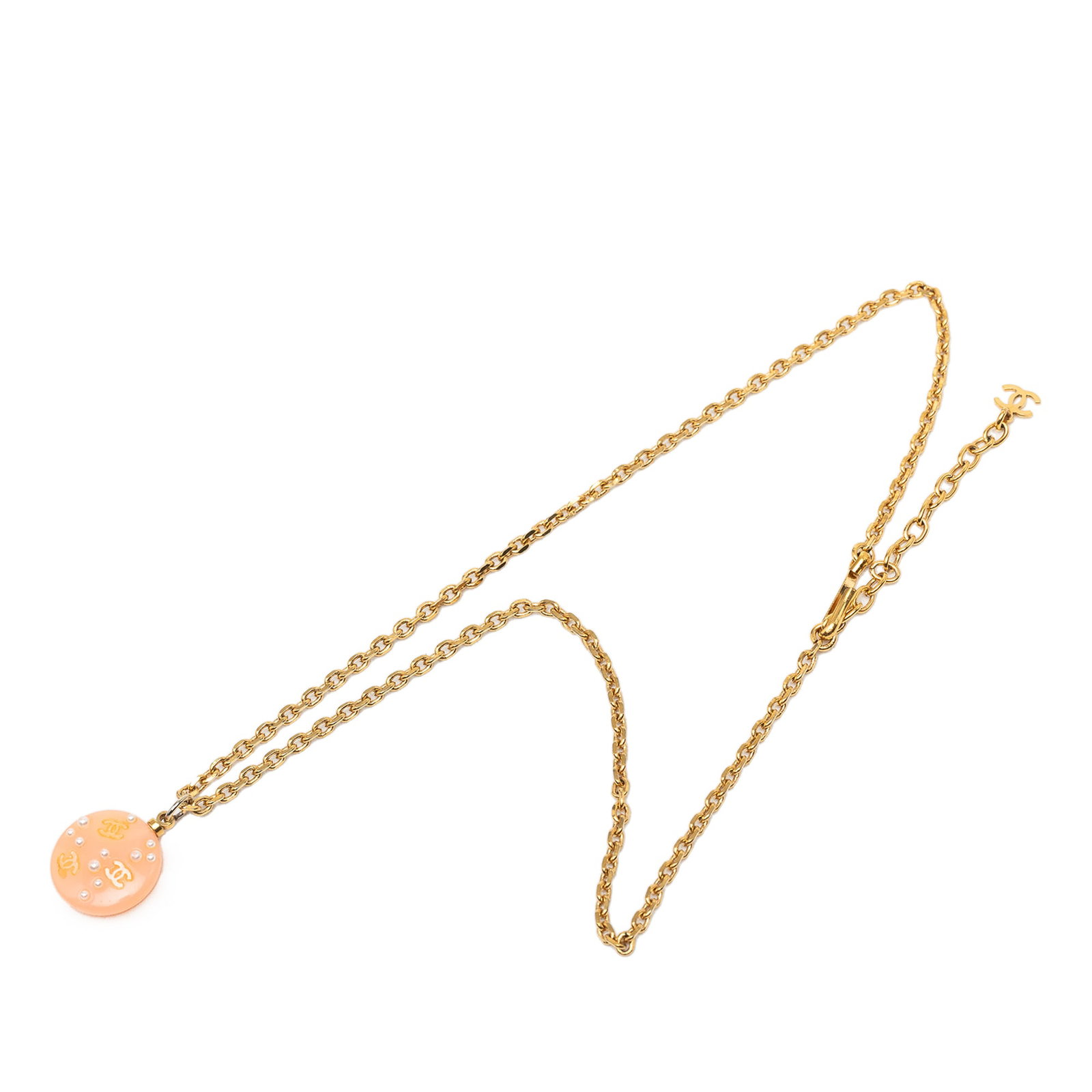 Chanel CC Pendant Necklace with Faux Pearl Resin Charm: Chanel CC Pendant Necklace with Faux Pearl Resin Charm Chanel CC pendant necklace featuring a round resin pendant with faux pearl detailing and a hook closure. The design combines pink plastic element