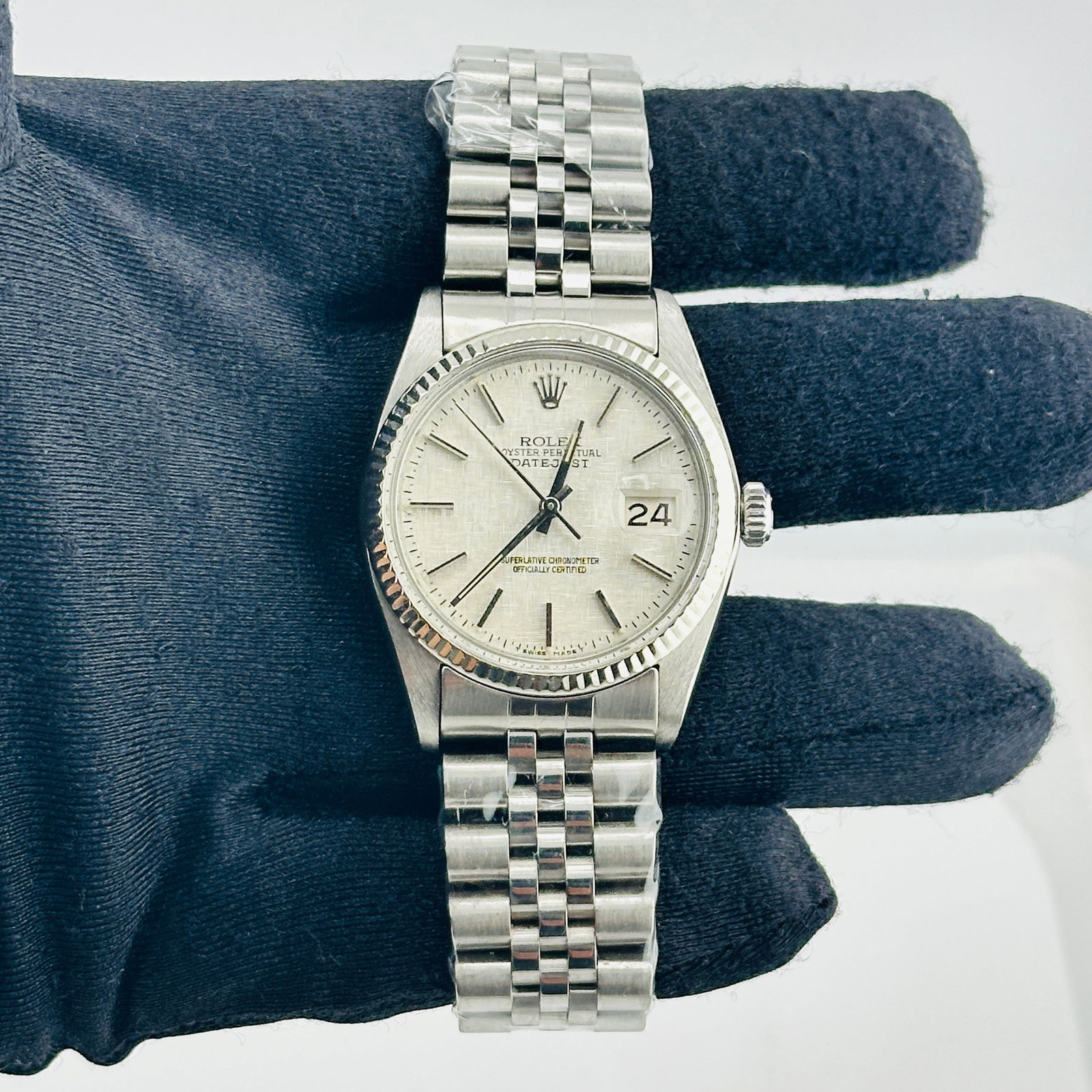 Rolex Datejust Ref. 16014 Mens Watch Silver Linen Dial aftermarket Jubilee Bracelet: Rolex Datejust Ref. 16014 Mens Watch Silver Linen Dial aftermarket Jubilee Bracelet Rolex Datejust reference 16014 with a silver linen dial, fluted bezel, and Aftermarket Jubilee bracelet. This men's 