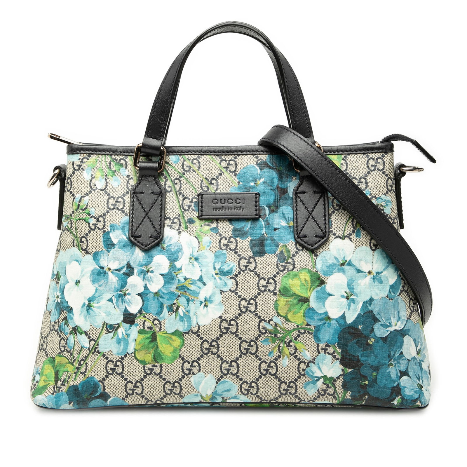 Gucci Blooms GG Supreme zip tote with leather strap: Gucci Blooms GG Supreme zip tote with leather strap This Gucci GG Supreme Blooms Zippered Tote is crafted in coated canvas with flat leather handles and a detachable leather strap. The bag features a 