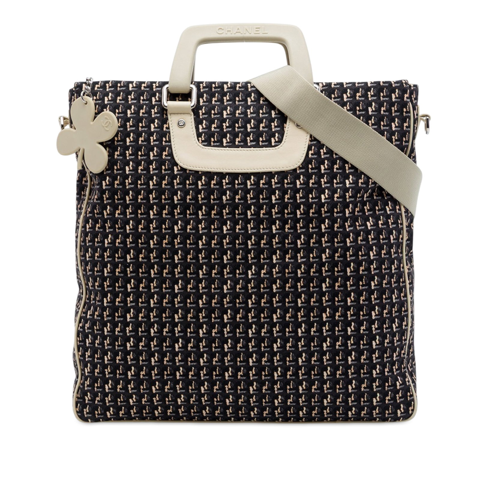 Chanel CC Clover Vertical Tote Canvas and Leather Bag: Chanel CC Clover Vertical Tote Canvas and Leather Bag A Chanel CC Canvas Clover Vertical Tote crafted with a canvas body and leather trim. This satchel features flat leather handles, an adjustable and