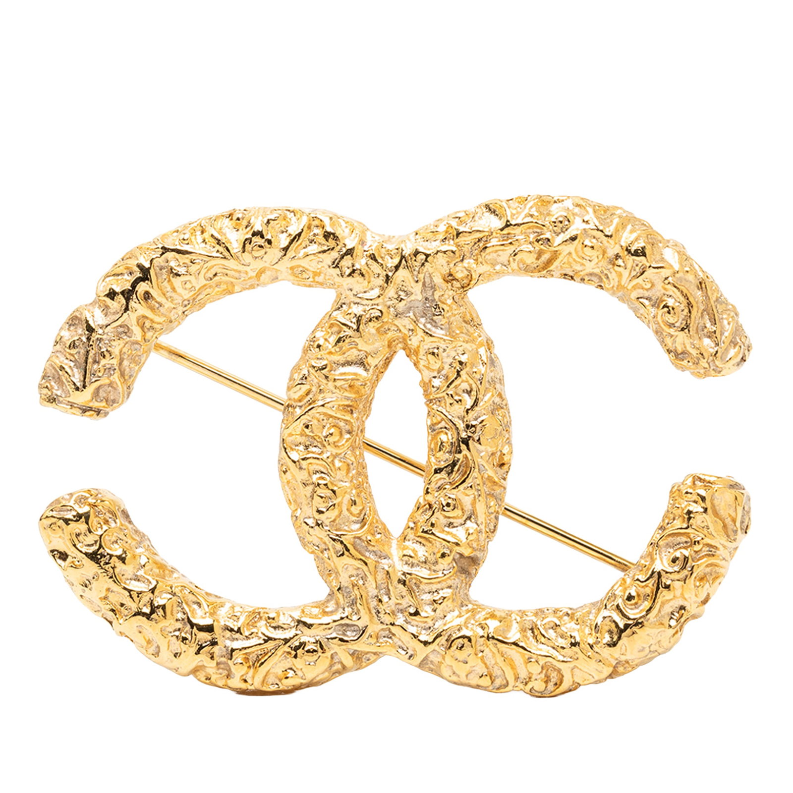 Chanel CC Baroque Embossed Gold Plated Metal Brooch: Chanel CC Baroque Embossed Gold Plated Metal Brooch Chanel CC Baroque Embossed Brooch in gold plated metal with a back pin closure. This costume jewelry piece is made in France and shows wear consiste