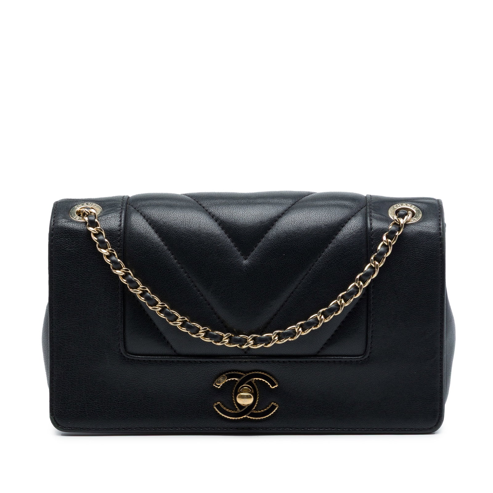 Chanel Mademoiselle Mini Chevron Flap Crossbody in Black Sheepskin: Chanel Mademoiselle Mini Chevron Flap Crossbody in Black Sheepskin A Chanel Mini Quilted Chevron Sheepskin Mademoiselle Vintage Flap crossbody bag crafted in black sheepskin leather. It features a lea