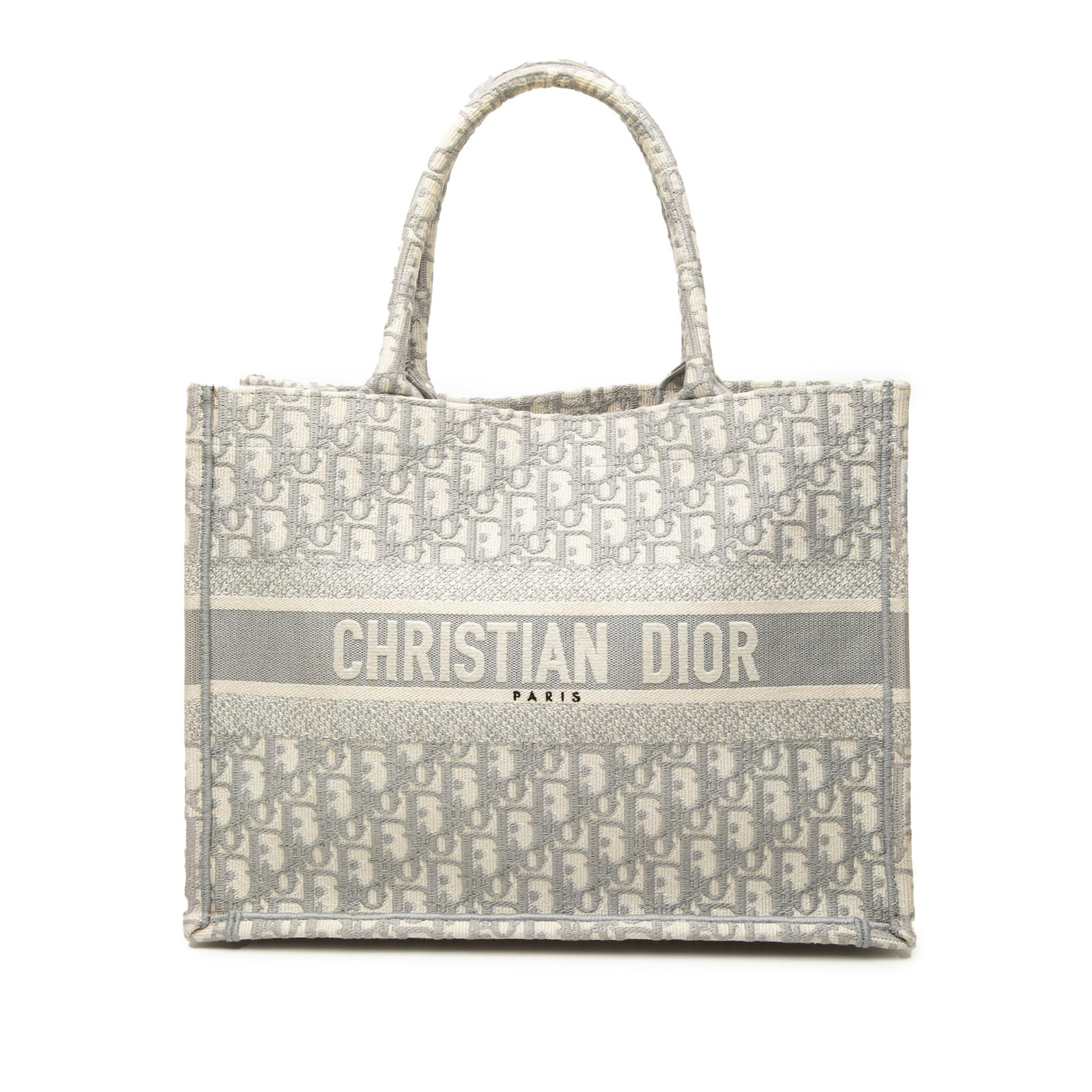Dior Book Tote Medium Oblique Embroidered Canvas Bag: Dior Book Tote Medium Oblique Embroidered Canvas Bag A Dior Medium Book Tote in gray oblique embroidered canvas, made in Italy. This open-top bag features rolled canvas handles and a structured silhou