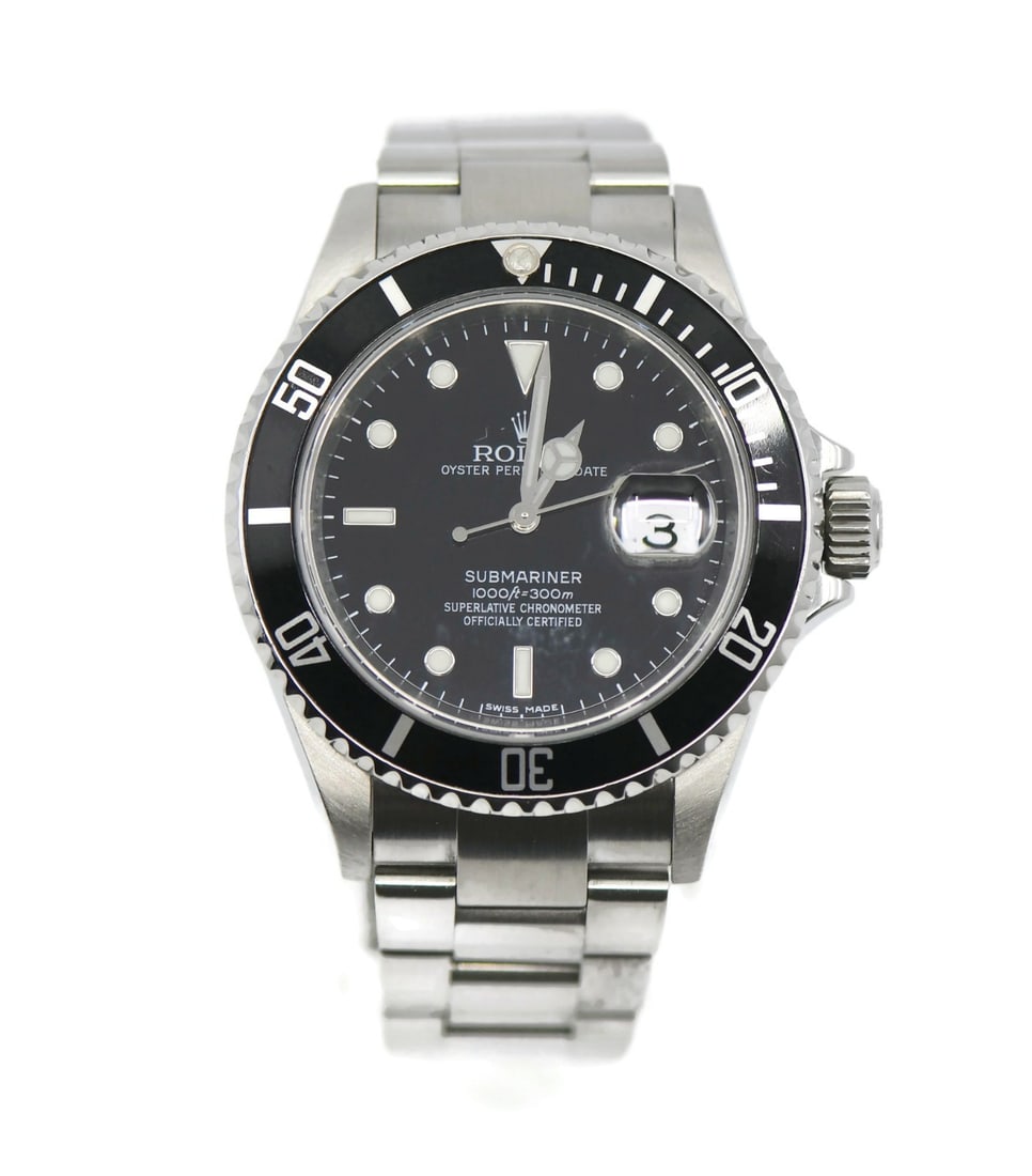 Rolex 16610 Submariner wristwatch in stainless steel with box: Rolex 16610 Submariner wristwatch in stainless steel with box Pre-owned Rolex Submariner ref. 16610 wristwatch with a black dial and black unidirectional rotating bezel. This automatic watch features 
