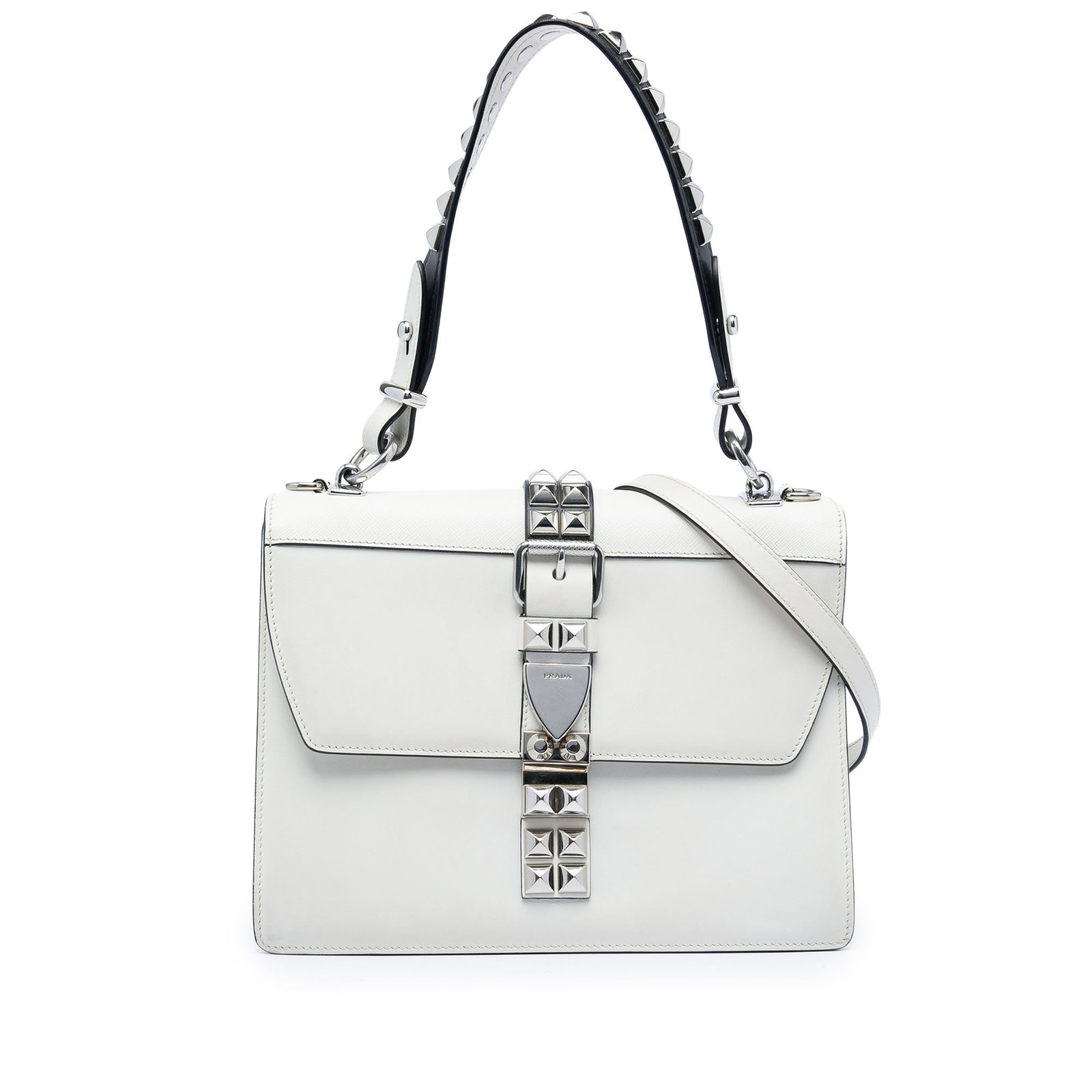 Prada Elektra Satchel in White Calf and Saffiano Leather: Prada Elektra Satchel in White Calf and Saffiano Leather Prada City Calf and Saffiano Studded Elektra satchel in white leather with studded top-handle detailing and a detachable flat leather strap. Th