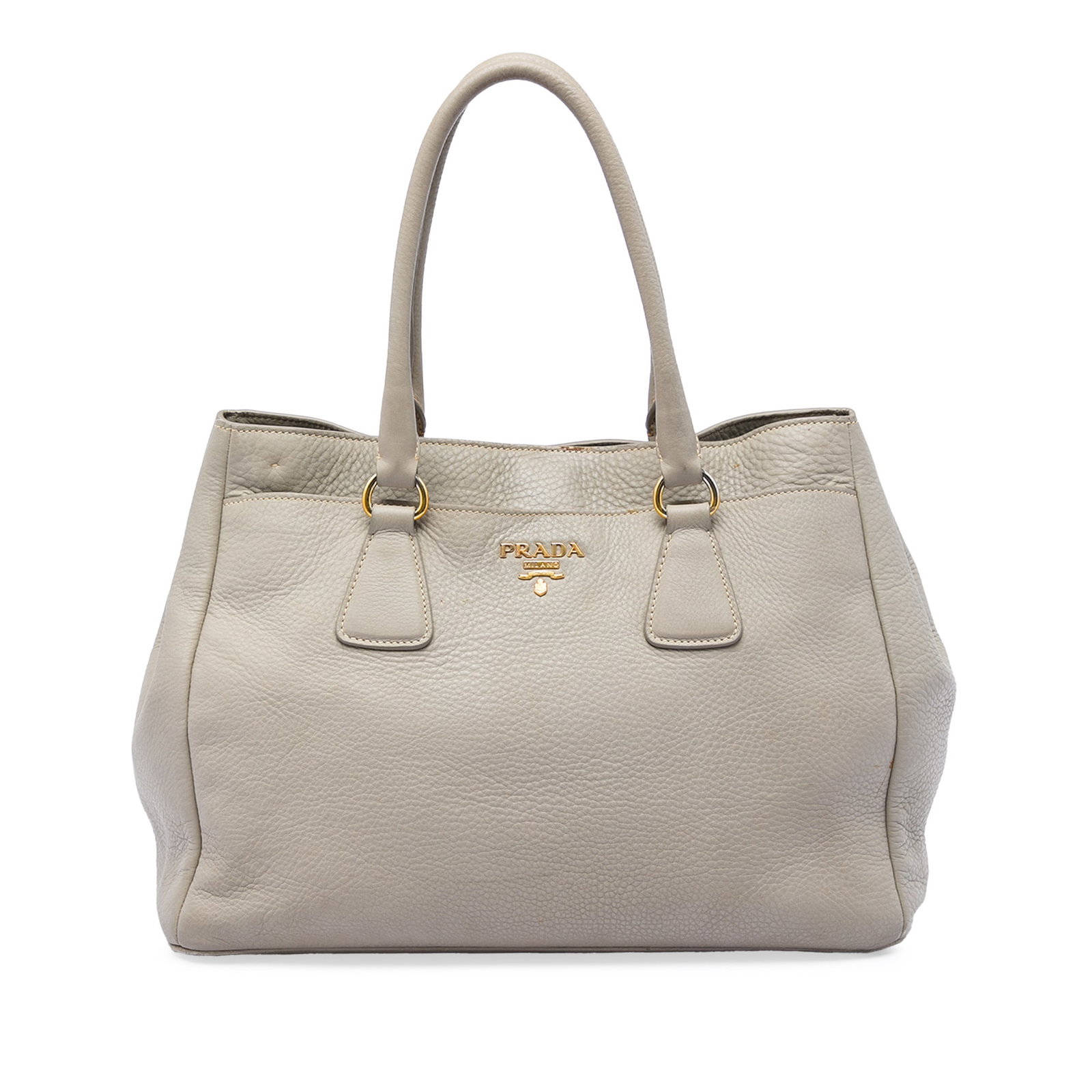 Prada Vitello Daino leather satchel tote in gray: Prada Vitello Daino leather satchel tote in gray Prada Vitello Daino Open Convertible Tote in gray leather with rolled leather handles, an open top with magnetic closure, exterior front and back slip 